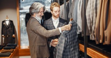 men picking a suit in a suit shop