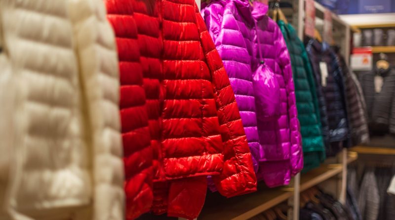 assorted color bubble jackets hanged